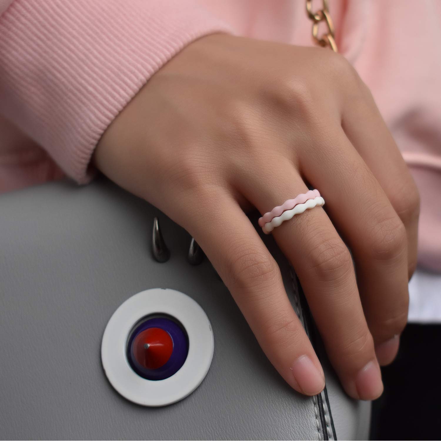 Woman holding her purse wearing our stackable Wavy Women's Silicone Rings. The Best Silicone Wedding Rings For Women Online.